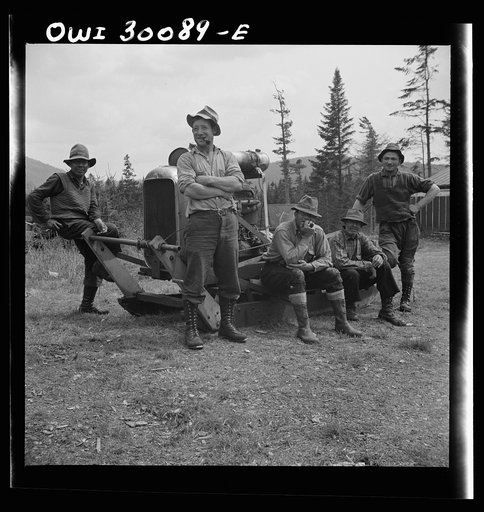 Untitled photo, possibly related to:  Spring pulpwood drive on the Brown Company timber holdings in Maine. Mid-afternoon "lunch" by Long Pond where woodsmen are sluicing. On the menu that day: roast pork and dressing, boiled potatoes, turnips, baked beans, hot cakes, hot biscuits, bread, butter, coo