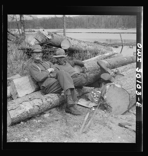 Spring pulpwood drive on the Brown Company timber holdings in Maine. Woodsmen relaxing after mid-afternoon lunch