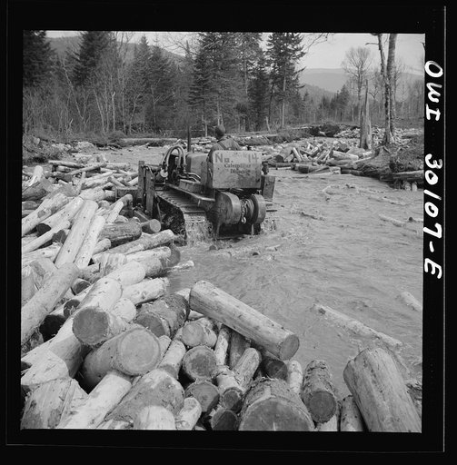 Spring pulpwood drive on the Brown Company timber holdings in Maine. Bulldozer clearing a channel in Dennison Bog Brook so that another jam will not form
