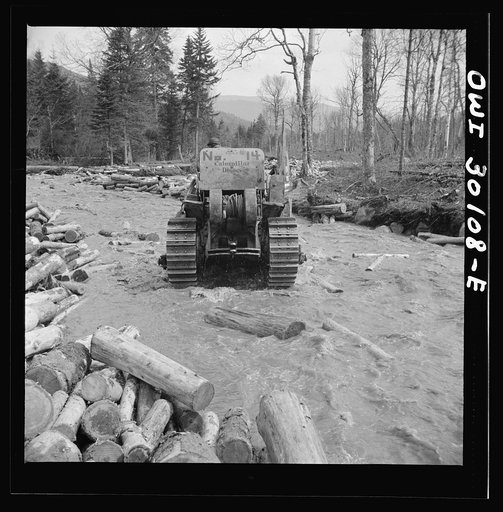 Spring pulpwood drive on the Brown Company timber holdings in Maine. Bulldozer clearing a channel in Dennison Bog Brook so that another jam will not form