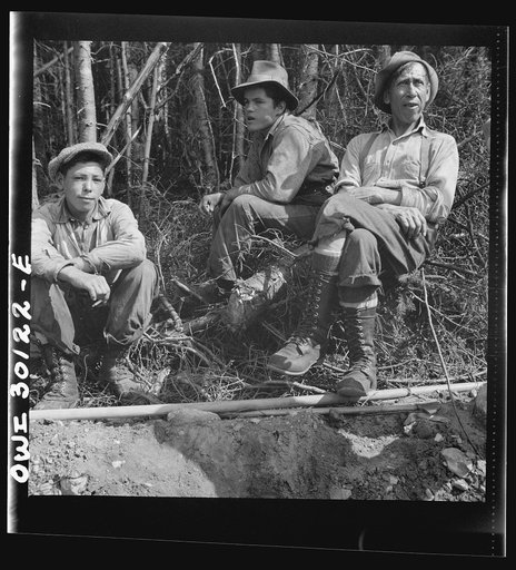 Untitled photo, possibly related to: Spring pulpwood drive, Brown Company timber holdings. Mid-morning or mid-afternoon lunch by the side of the road near where the woodsmen are working. Maine
