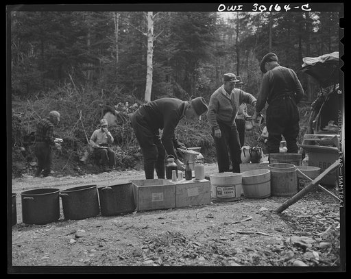 Spring pulpwood drive on the Brown Company timber holdings in Maine. At ten o'clock and two o'clock woodsmen eat near their work, serving themselves cafeteria style with plenty of opportunity for second helpings. They eat four meals daily throughout the drive
