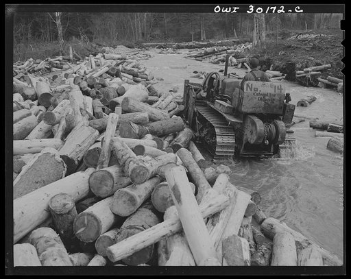 Untitled photo, possibly related to: Spring pulpwood drive, Brown Company timber holdings, Maine. Bulldozer clears a channel in Dennison Bog Brook so that another jam will not form