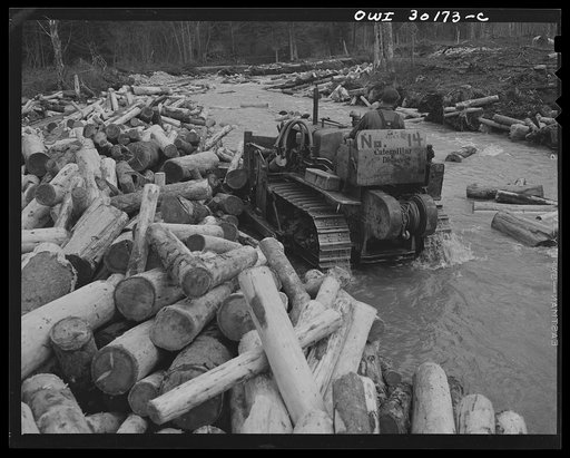 Spring pulpwood drive, Brown Company timber holdings in Maine. Bulldozer clearing a channel in Dennison Bog Brook so that another jam will not form