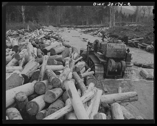 Spring pulpwood drive, Brown Company timber holdings, Maine. Bulldozer clears a channel in Dennison Bog Brook so that another jam will not form