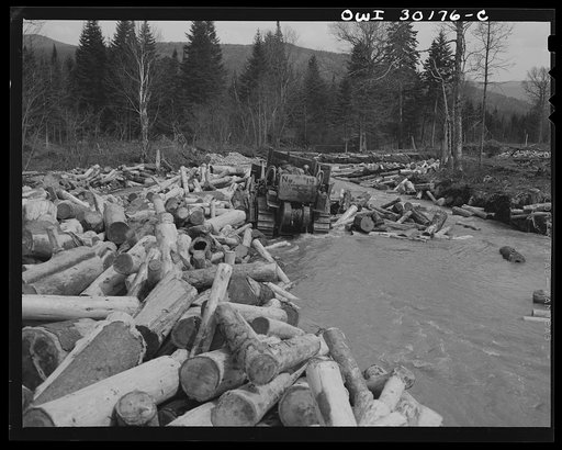 Spring pulpwood drive on the Brown Company timber holdings in Maine. Bulldozer clears a channel in Dennison Bog Brook so that another jam will not form