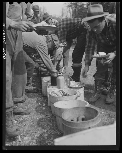 Spring pulpwood drive on the Brown Company timber holdings in Maine. At ten o'clock and two o'clock woodsmen eat near their work, serving themselves cafeteria style with plenty of opportunity for second helpings. They eat four meals daily throughout the drive
