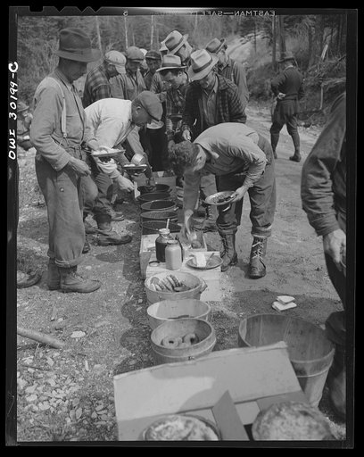Spring pulpwood drive on the Brown Company timber holdings in Maine. At ten o'clock and two o'clock woodsmen eat near their work, serving themselves cafeteria style with plenty of opportunity for second helpings. They eat four meals daily throughout the drive. Desserts include several kinds of cooki