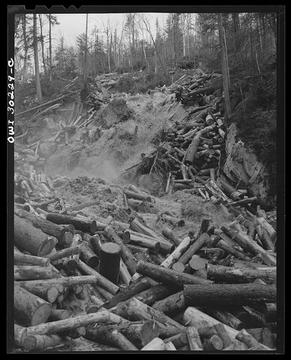 Spring pulpwood drive on the Brown Company timber holdings in Maine. A "head" of water released from a dam upstream carrying the logs in its path down to larger streams and rivers of water