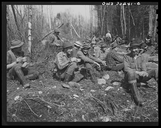 Untitled photo, possibly related to: Spring pulpwood drive on the Brown Company timber holdings in Maine. Mid-morning or mid-afternoon lunch by the side of the road near where woodsmen are working