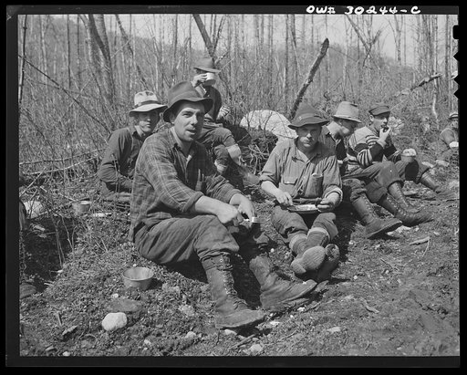 Spring pulpwood drive on the Brown Company timber holdings in Maine. Mid-morning or mid-afternoon lunch by the side of the road near where woodsmen are working