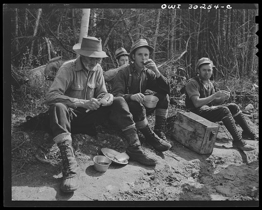 Spring pulpwood drive on the Brown Company timber holdings in Maine. Mid-morning or mid-afternoon lunch by the side of the road near where the woodsmen are working