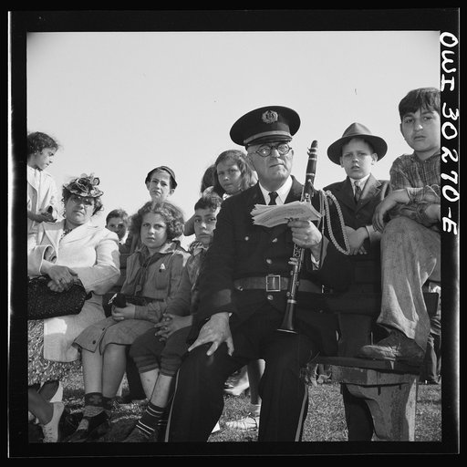 Gloucester, Massachusetts. Memorial Day, 1943. An aged member of the American Legion band resting after the parade