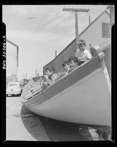 Gloucester, Massachusetts. Boys who hang around the fishing docks hope some day to go to sea as fishermen themselves