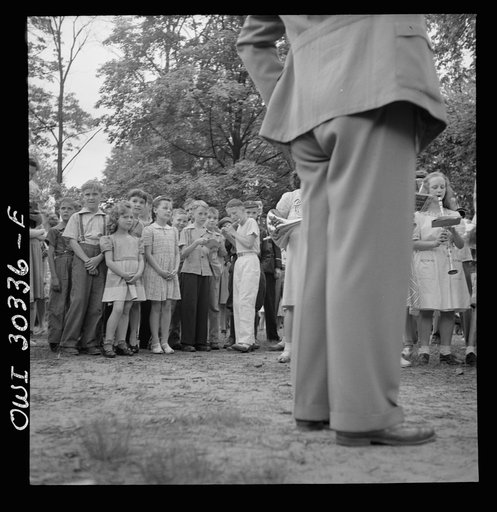 Gallipolis, Ohio. Boys and girls listening to school band at Decoration Day ceremony