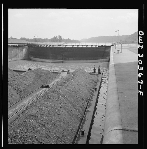 Coal barges going through lock
