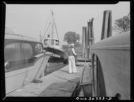 Coast Guardsmen tying up boat near Point Pleasant, West Virginia
