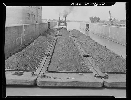 Coal barges going through locks