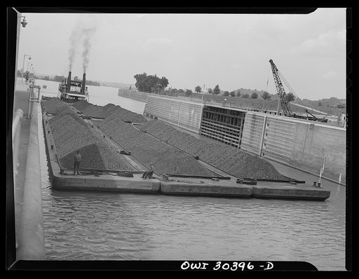 Coal barges going through locks