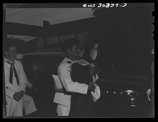 Untitled photo, possibly related to: Chief Hawman, boatswain, pouring rice over newlywed coast guardsman's wife