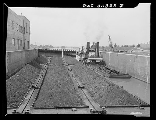 Coal barges going through locks