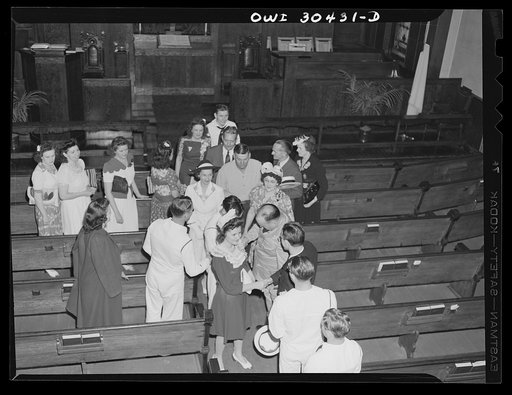 Untitled photo, possibly related to: Chief Hawman, boatswain, pouring rice over newlywed coast guardsman's wife