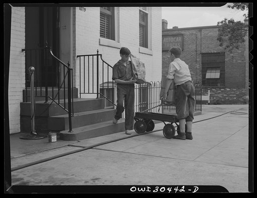 Untitled photo, possibly related to: Washington, D.C. "I'll carry mine," a campaign to conserve transportation facilities and thus save rubber and gasoline. Boys delivering packages