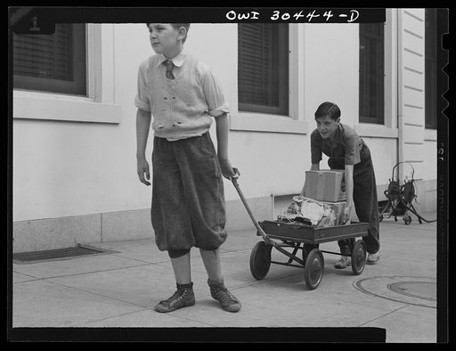 Untitled photo, possibly related to: Washington, D.C. "I'll Carry Mine," a campaign to conserve transportation facilities and thus save rubber and gasoline. Boys delivering packages