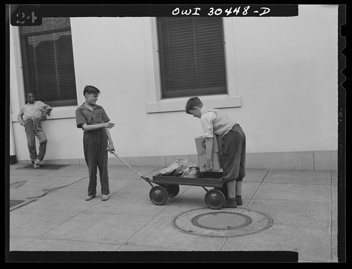 Untitled photo, possibly related to: Washington, D.C. "I'll Carry Mine," a campaign to conserve transportation facilities and thus save rubber and gasoline. Boys delivering packages