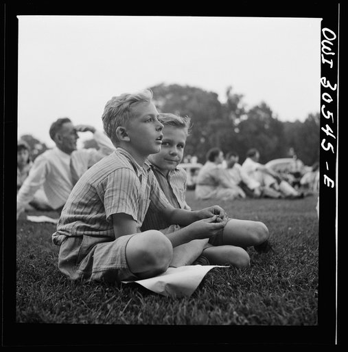 Untitled photo, possibly related to: Washington, D.C. Listening to the U.S. Army band play at a free concert in front of the Capitol
