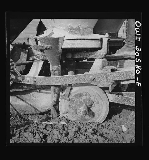 Fort Kent, Aroostook County, Maine. Spring potato planting on the French Acadian farm of Leonard Gagnon. Harrows of a potato seeding machine