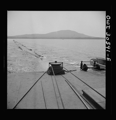 Spring pulpwood drive on the Brown Company timber holdings in Maine. On its return trip up Mooselookmeguntic Lake, the steamer tows an empty boom to be refilled for the next day's load