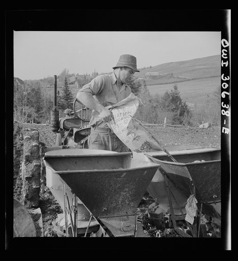 Spring potato planting on the French Acadian farm of Leonard Gagnon. Fort Kent, Aroostook County, Maine