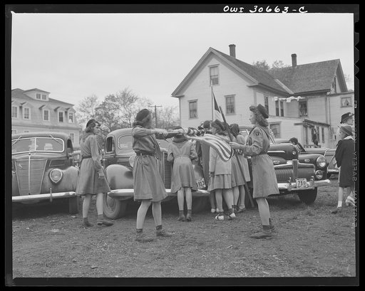 Ashland, Aroostook County, Maine. Girl scouts folding up the flag after the Memorial Day ceremonies