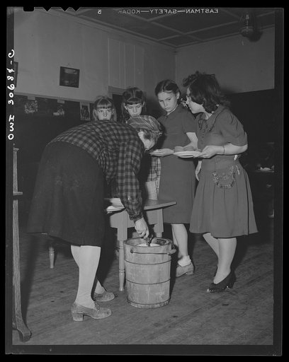 Buffalo Hill, Aroostook County, Maine. Farm woman dishing out homemade wild strawberry ice cream, one of the refreshments served in the social period after Congregational church service in a one-room schoolhouse