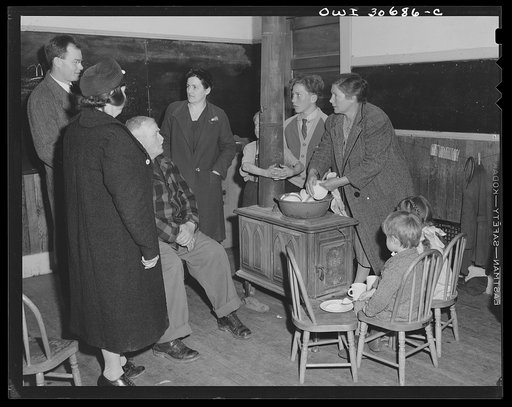 Buffalo Hill, Aroostook County, Maine. Older members of the congregation discussing common problems with the minister after church services held in this one-room rural school house