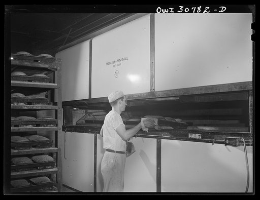 Pittsburgh, Pennsylvania. Paul Hermann, German, baking loaves of Lithuanian rye bread in a Lithuanian bakery