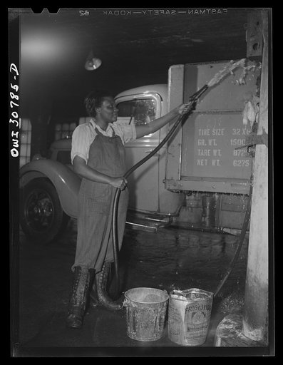 Untitled photo, possibly related to: Pittsburgh, Pennsylvania. Lillie Smith, working as a car washer in a garage, earns fifty-five cents per hour. She formerly did housework but likes this much better; she has one brother in the U.S. Army