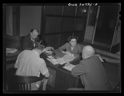 OPA (Office of Price Administration) lawyers, including a woman, hold nightly hearings for violators of the pleasure driving regulations