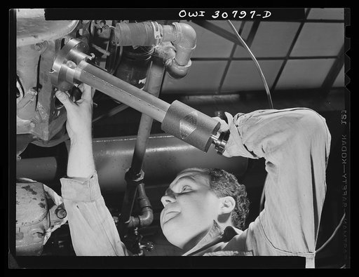 Substitute fuels tested. Conducting an experiment to determine whether engine wear is increased by the use of fuel substitutes, Emmet L. Reed of Washington, D.C. makes an identification mark on the cylinder of an automobile engine. The rate of the mark's disappearance will determine the degree of we