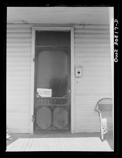 Beaumont, Texas. Sign on a porch door