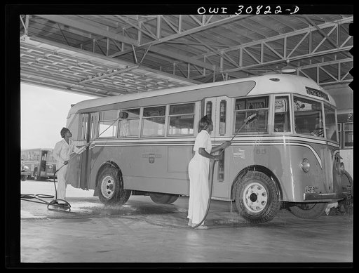 Beaumont, Texas. Women washing a bus at the city transit company