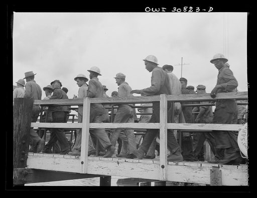 Untitled photo, possibly related to: Beaumont, Texas. Shipyard workers leaving the Pennsylvania shipyards at the change of shift