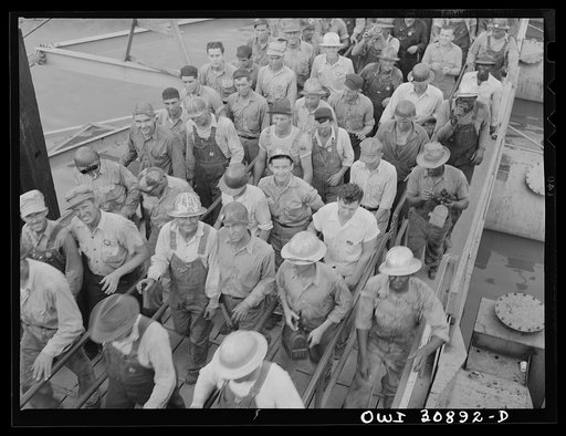 Untitled photo, possibly related to: Beaumont, Texas. Shipyard workers leaving the Pennsylvania shipyards at the change of shift