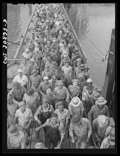 Beaumont, Texas. Shipyard workers leaving the Pennsylvania shipyards at the change of shift