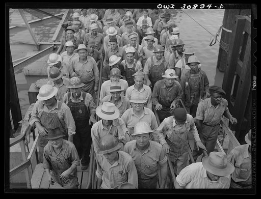 Beaumont, Texas. Shipyard workers leaving the Pennsylvania shipyards at the change of shift