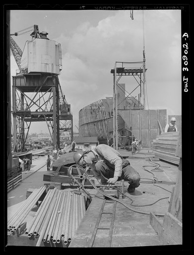 Beaumont, Texas. Welder on the hull of a cargo vessel at the Pennsylvania shipyards