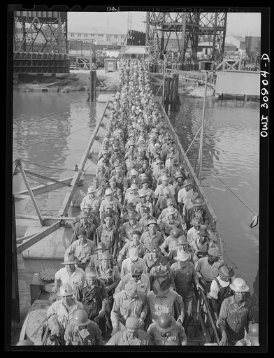 Beaumont, Texas. Shipyard workers leaving the Pennsylvania shipyards at the change of shift
