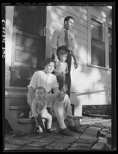 Beaumont, Texas. Mrs. Elsie McMullen, a laundry truck driver, with her family