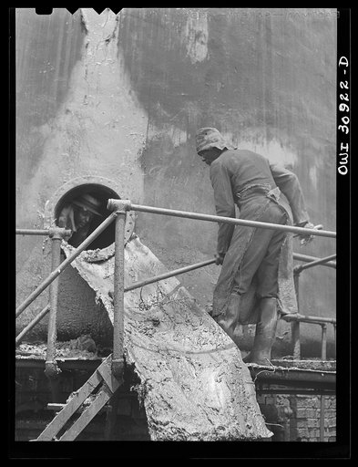 Beaumont, Texas. Cleaning out a vat in which creosote is stored at the International Creosoting Company